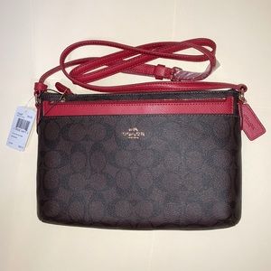 NWT. Signature Coach Purse. Brown and True Red.